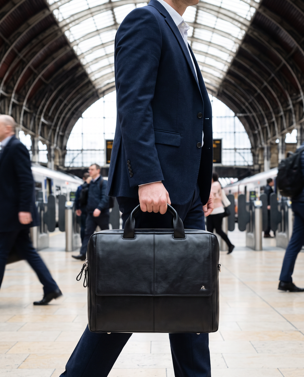 Anderson 15" black laptop bag, carried by a model