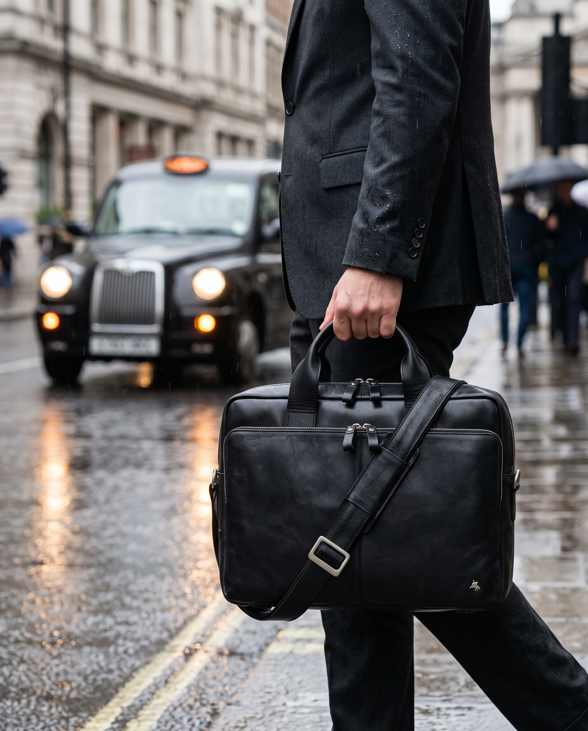 Hugo 15" black laptop bag, carried by a model