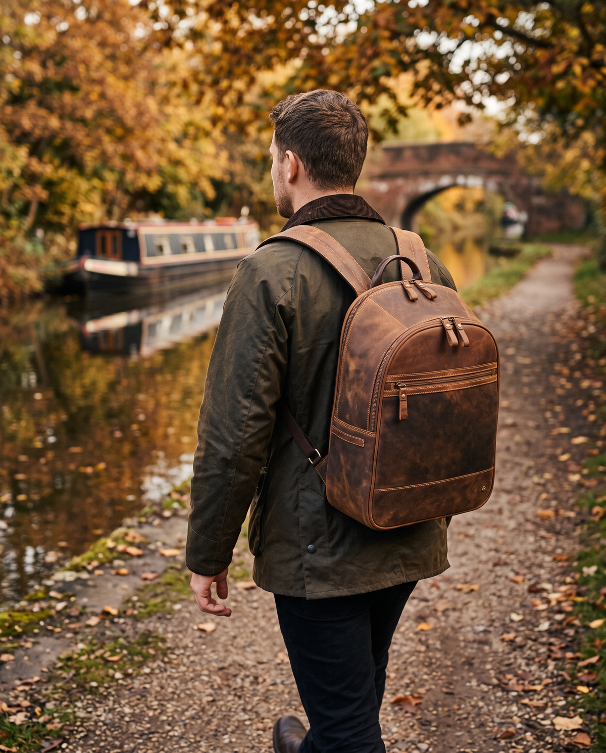 Tank 13" havana tan backpack, carried by a model