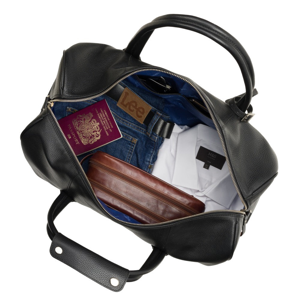 Explorer black holdall, open from above, packed for a weekend