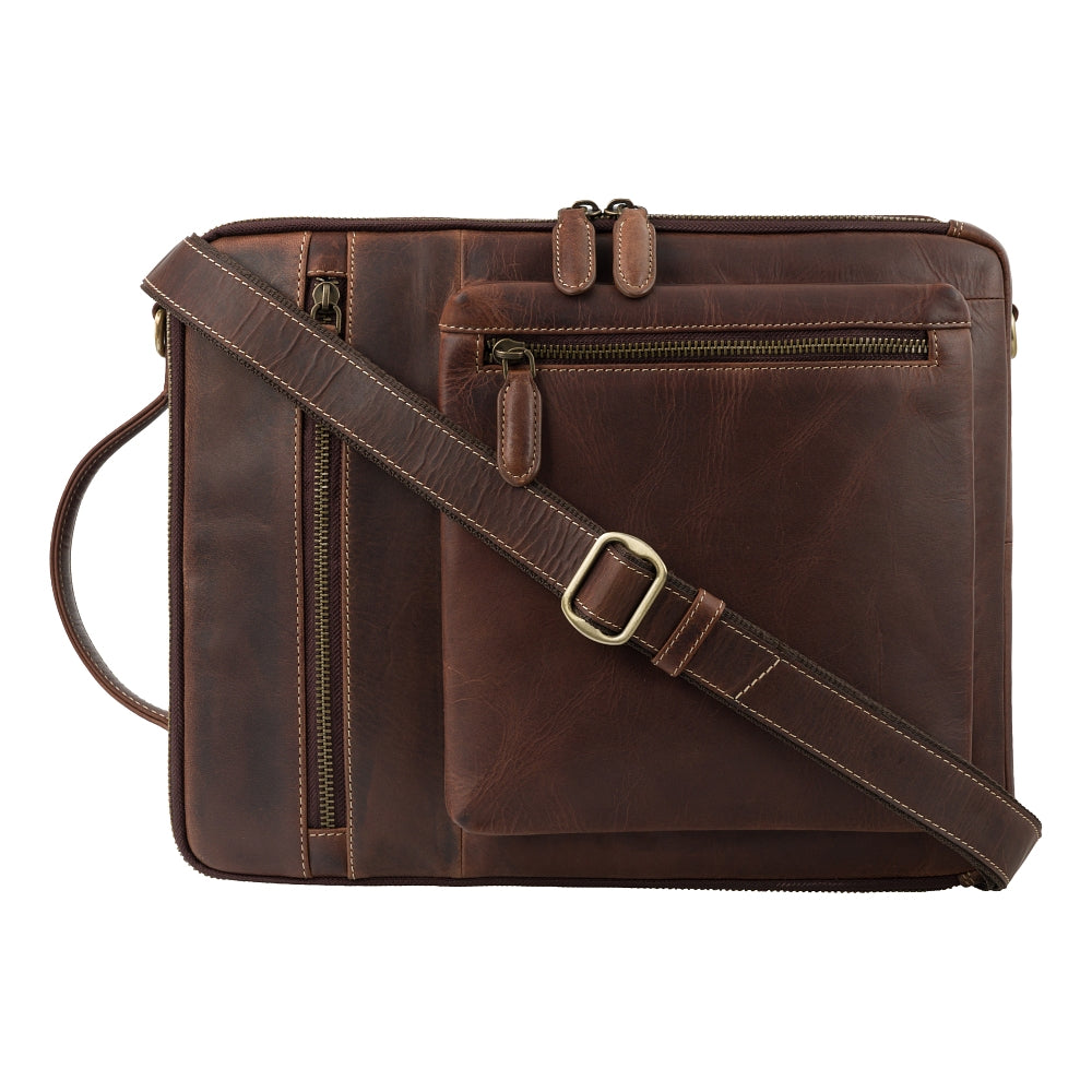 Skylar chestnut brown laptop bag, worn as a crossbody messenger, strap attached