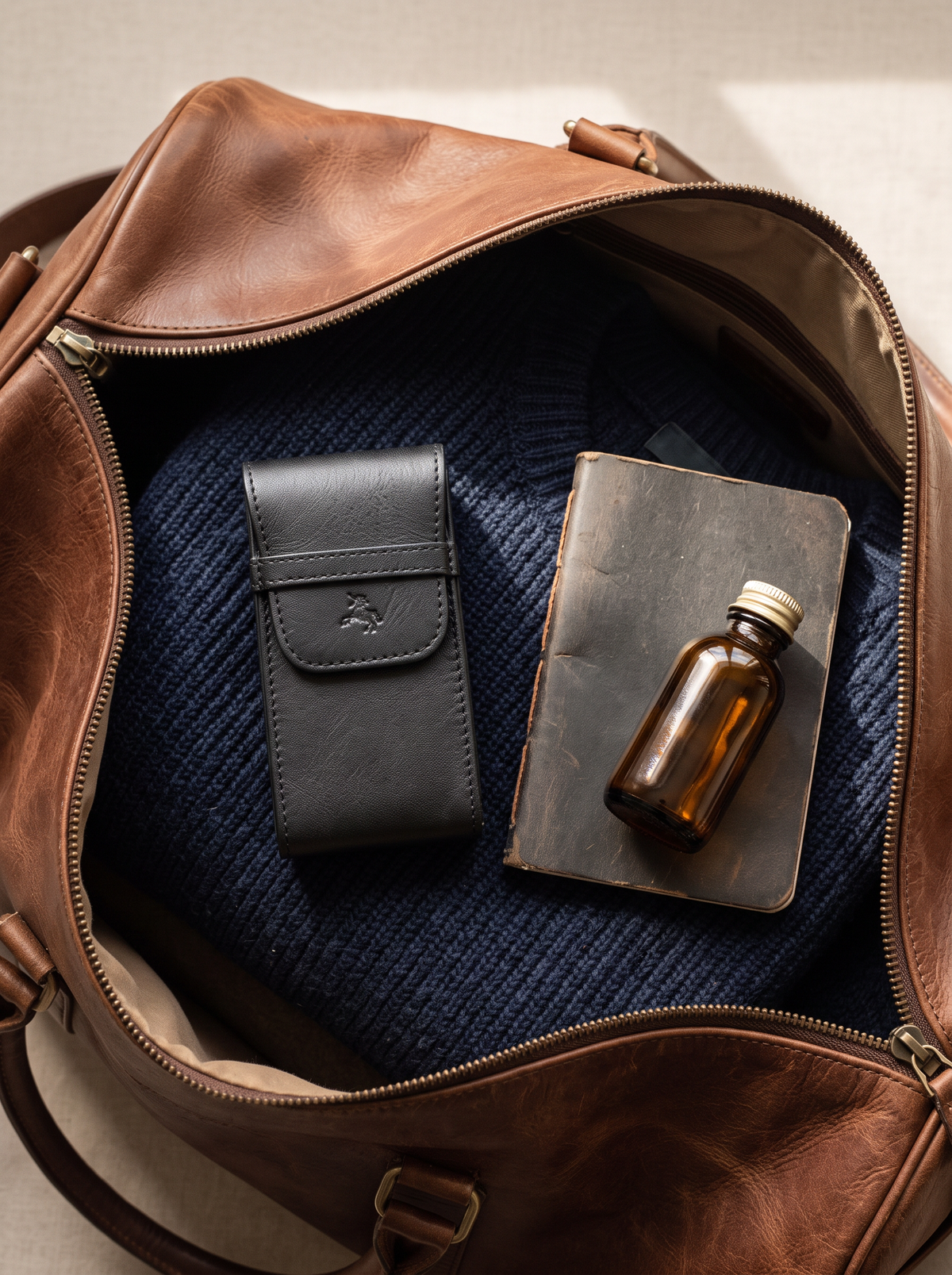 Time black watch pouch packed in a leather weekender