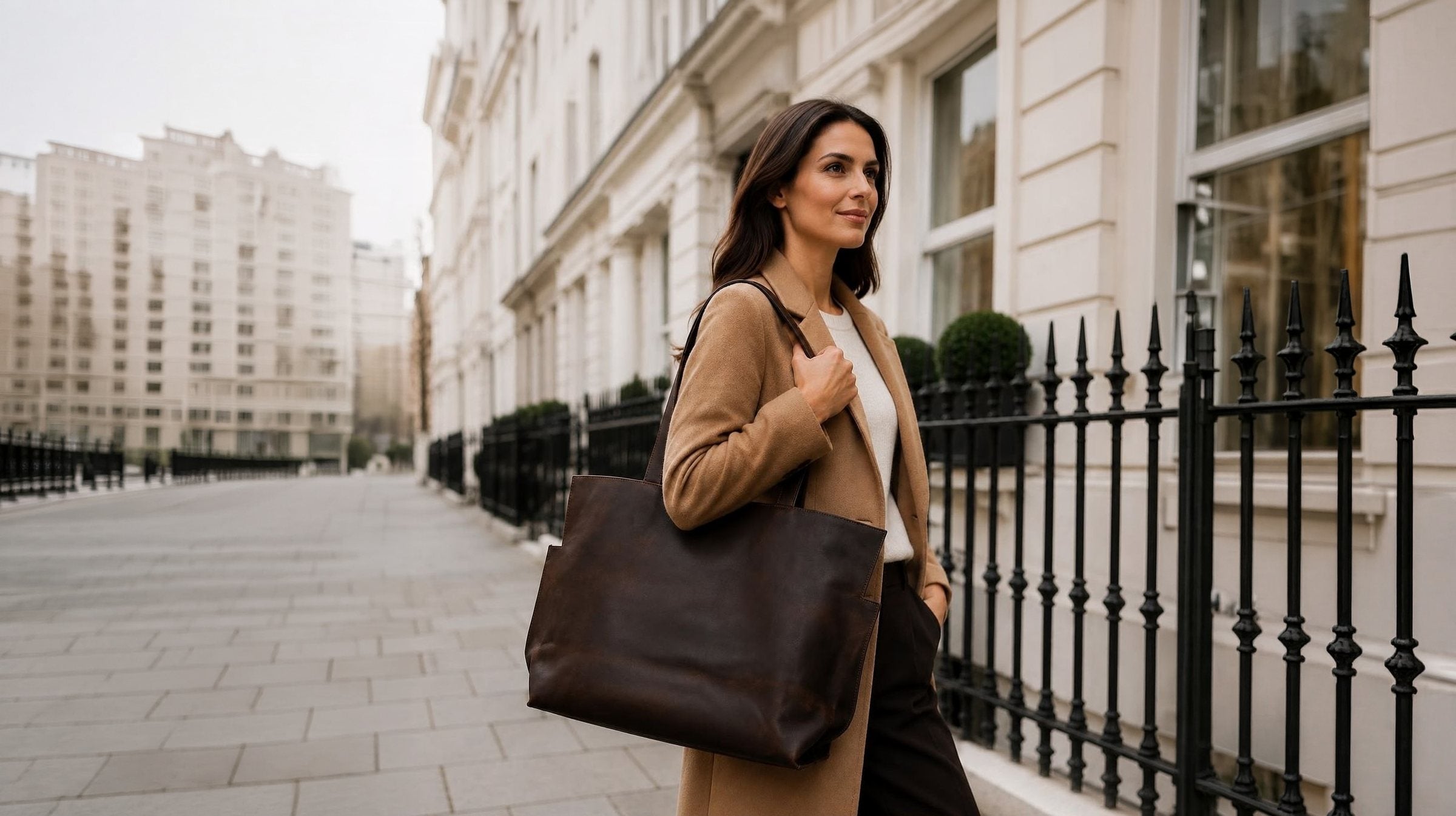 Woman carrying the brown leather maxi tote on a London street